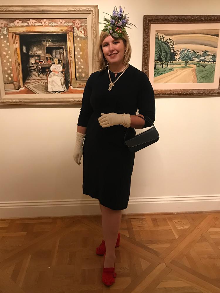 Photograph of a woman with a fancy had in the galleries