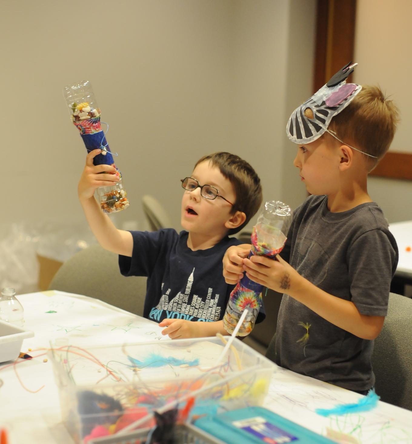 Young visitors showing off their wonderful creations!