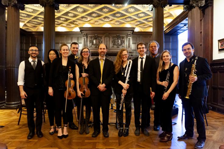 Photograph of group of musicians standing with their instruments in the Phillips Music Room