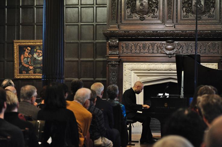 Aaron Diehl performing on the piano in the Music Room