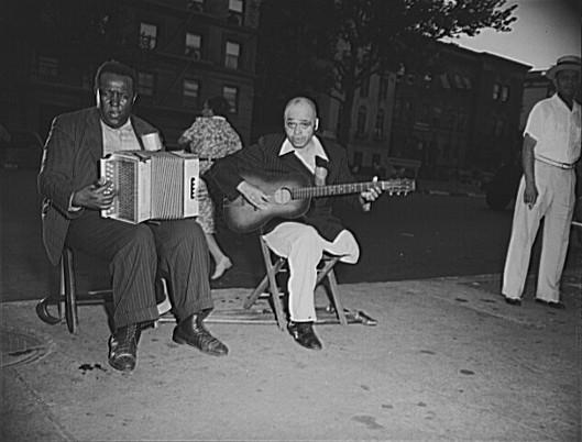Photograph by Roger Smith, New York, New York. Street musicians in Harlem. 1943