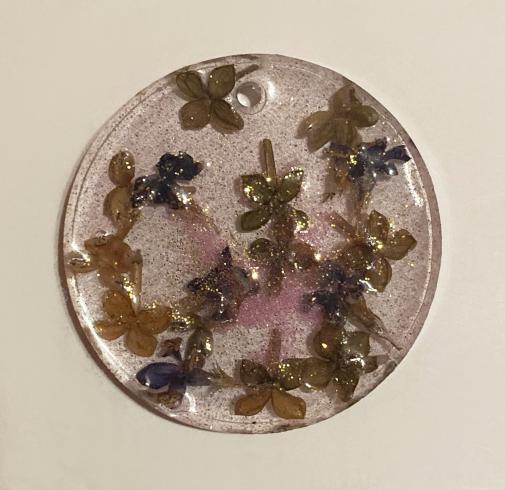 Resin art. Blossoms captured in a resin disc.