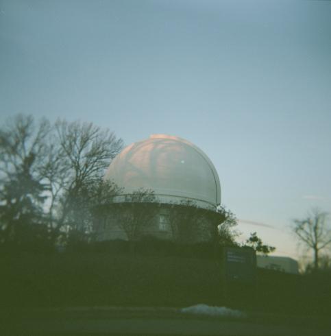 Image of a white dome building against a blue sky