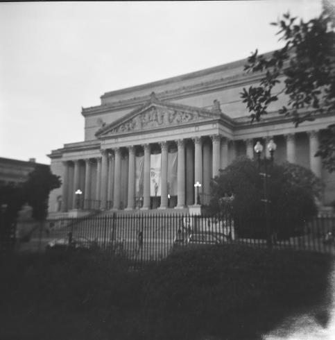 Black and white image of a columned building 