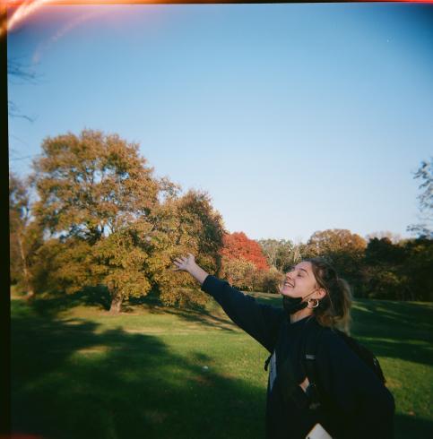 Image of a girl in a field of trees