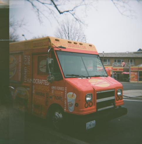 Image of an orange food truck 