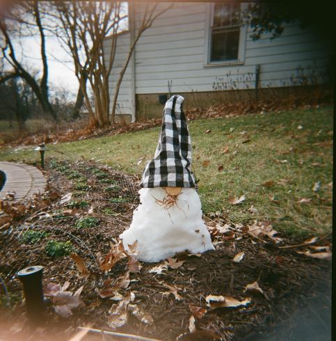 Image of a snowman with a plaid hat 