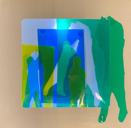 fluorescent light box with neon figurine cutouts  