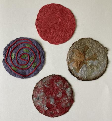 Four circular pieces of handmade paper