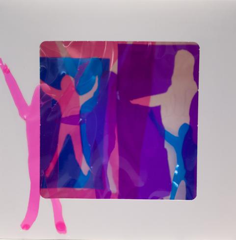 fluorescent light box with neon figurine cutouts  