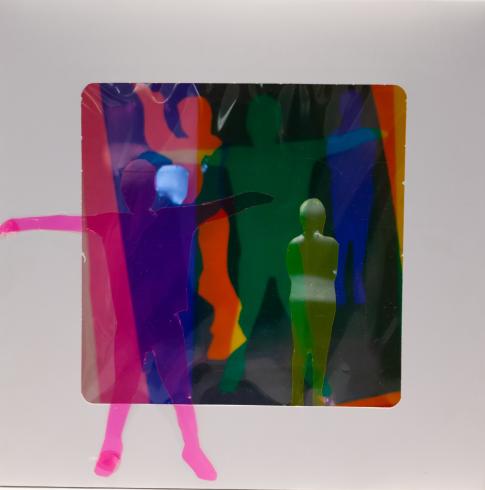 fluorescent light box with neon figurine cutouts  