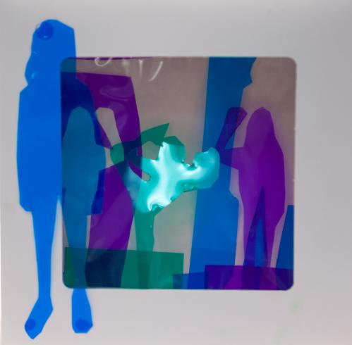 fluorescent light box with neon figurine cutouts  