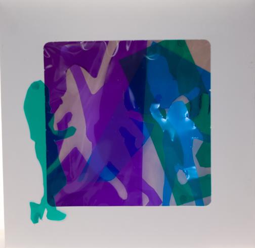 fluorescent light box with neon figurine cutouts  