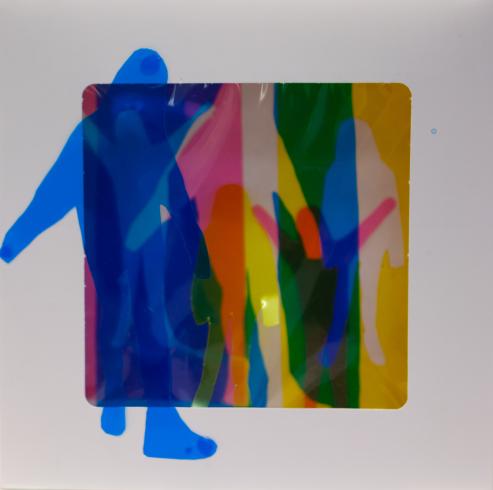 fluorescent light box with neon figurine cutouts  