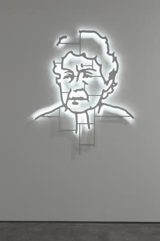 Sculpture made of metal of an outline of a woman that lights up