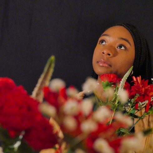 Photograph of student with their flower bouquet 