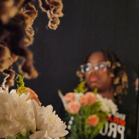 Photograph of student with their flower bouquet 