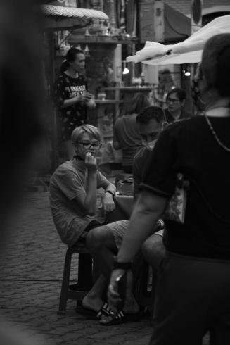 photograph taken by student of boy in a market 