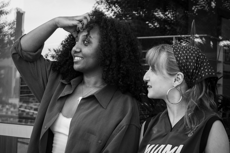 photograph of two girls looking left