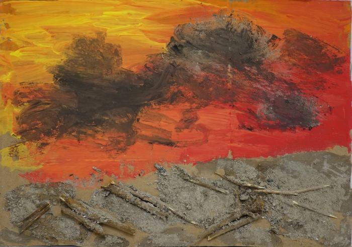 Cloud of smoke in a red yellow sky above a ground of sticks.