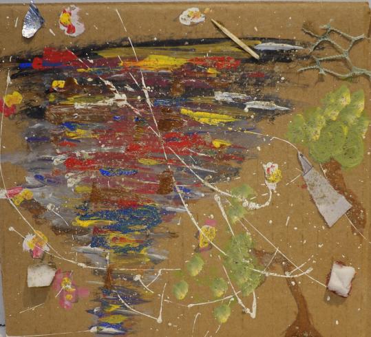 A tornado made of mixed paint, with plastic trash surrounding it.