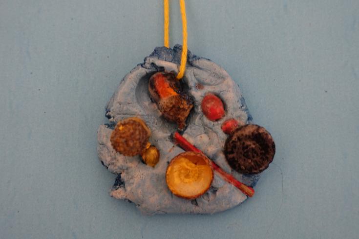 Clay mobile with acorns.