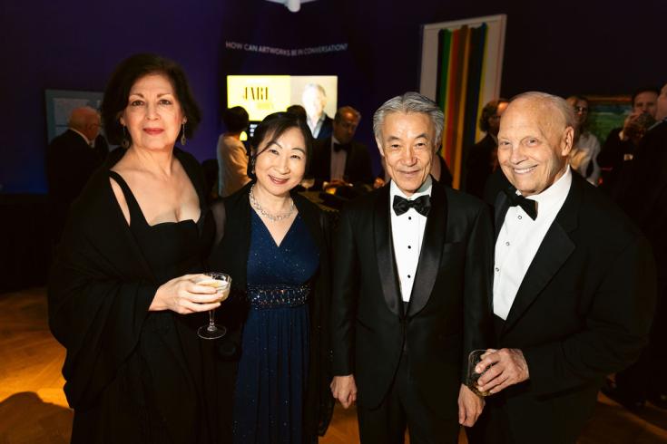 4 people dressed in black tie at the 2025 Phillips Annual Gala