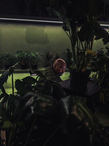 Photograph of Imka surrounded by plants