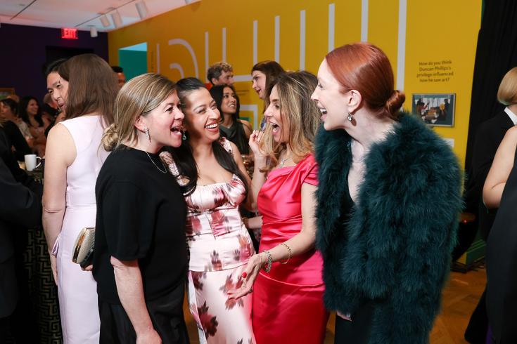 Guests at the Annual Gala After Party wearing black tie
