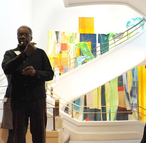 Sam Gilliam giving a talk in front of his work Flour Mill in the Goh Annex stairwell