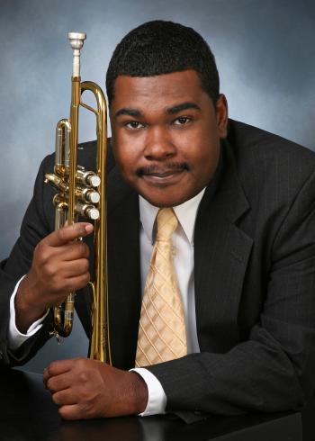 Donvonte McCoy holding a trumpet