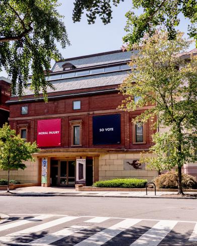 Photograph of exterior of The Phillips Collection with banners by Jenny Holzer