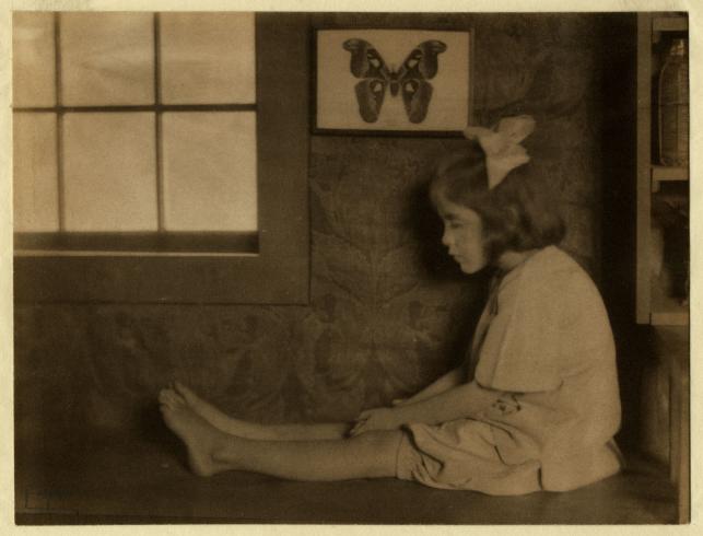 Young Girl Seated on Bench