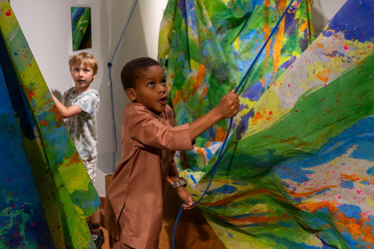 Two kids exploring Art-Play-Practice at THEARC