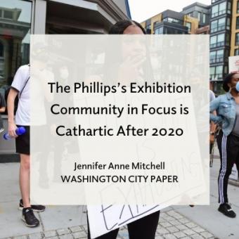 Woman at protest holding sign 