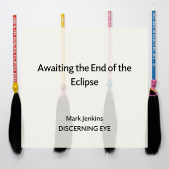 Thea Canlas (Baltimore, MD), My Filipino Baby #2, 2025, Human hair, plastic rattan, and wood, Each broom 42 x 40 x 1 1/2 in. Text overlay reads "Awaitign the End of the Eclipse, Mark Jenkins, Discerning Eye"